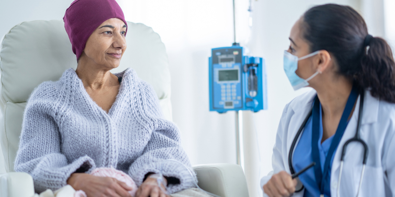 Oncologist talking with a patient.